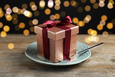 Photo of Beautiful table setting with romantic gift on wooden background, closeup