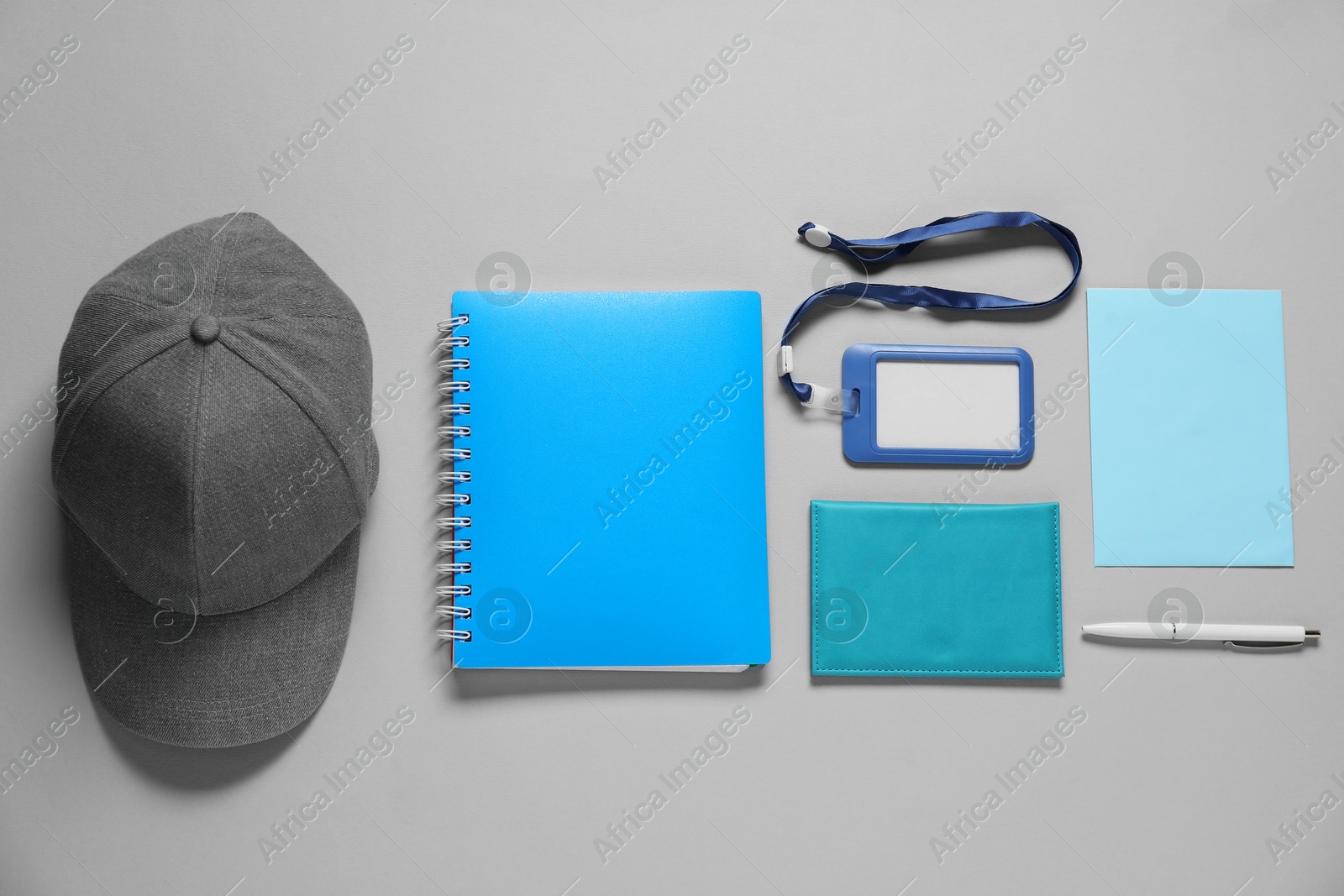 Photo of Different blank items for branding on gray background, flat lay. Mockup for design