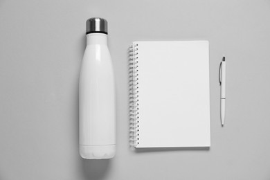 Photo of Different blank items for branding on gray background, flat lay. Mockup for design