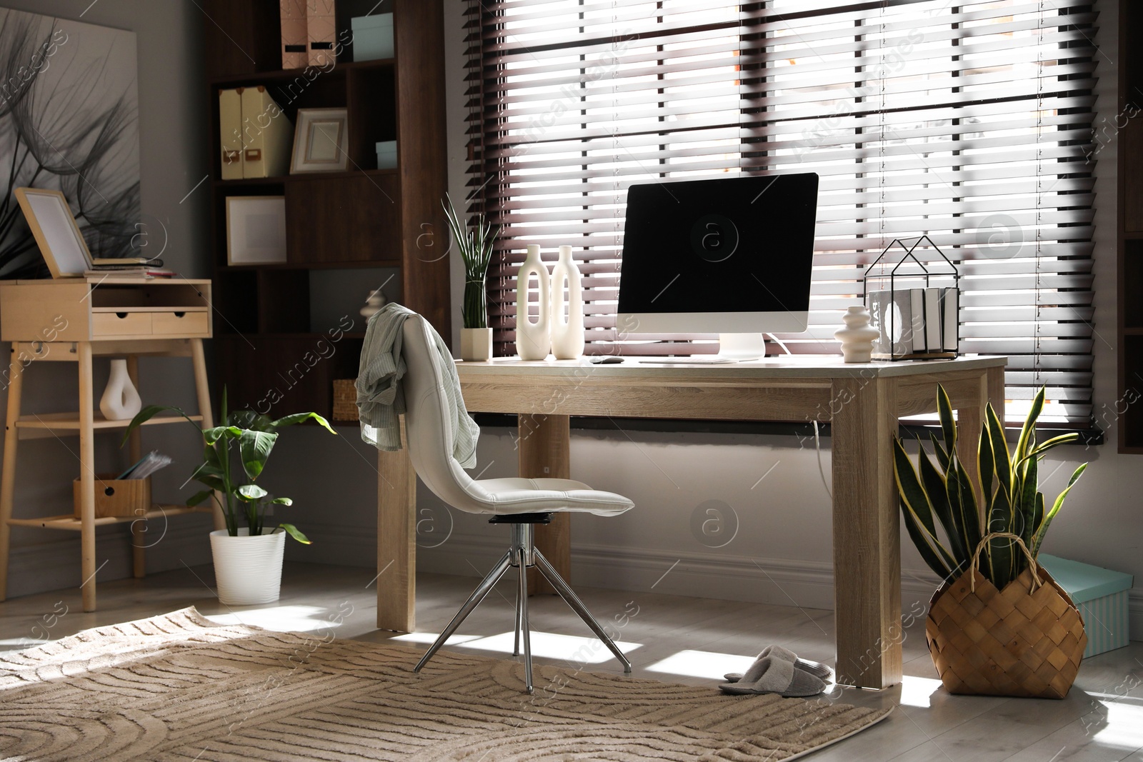 Photo of Comfortable workplace with computer in home office