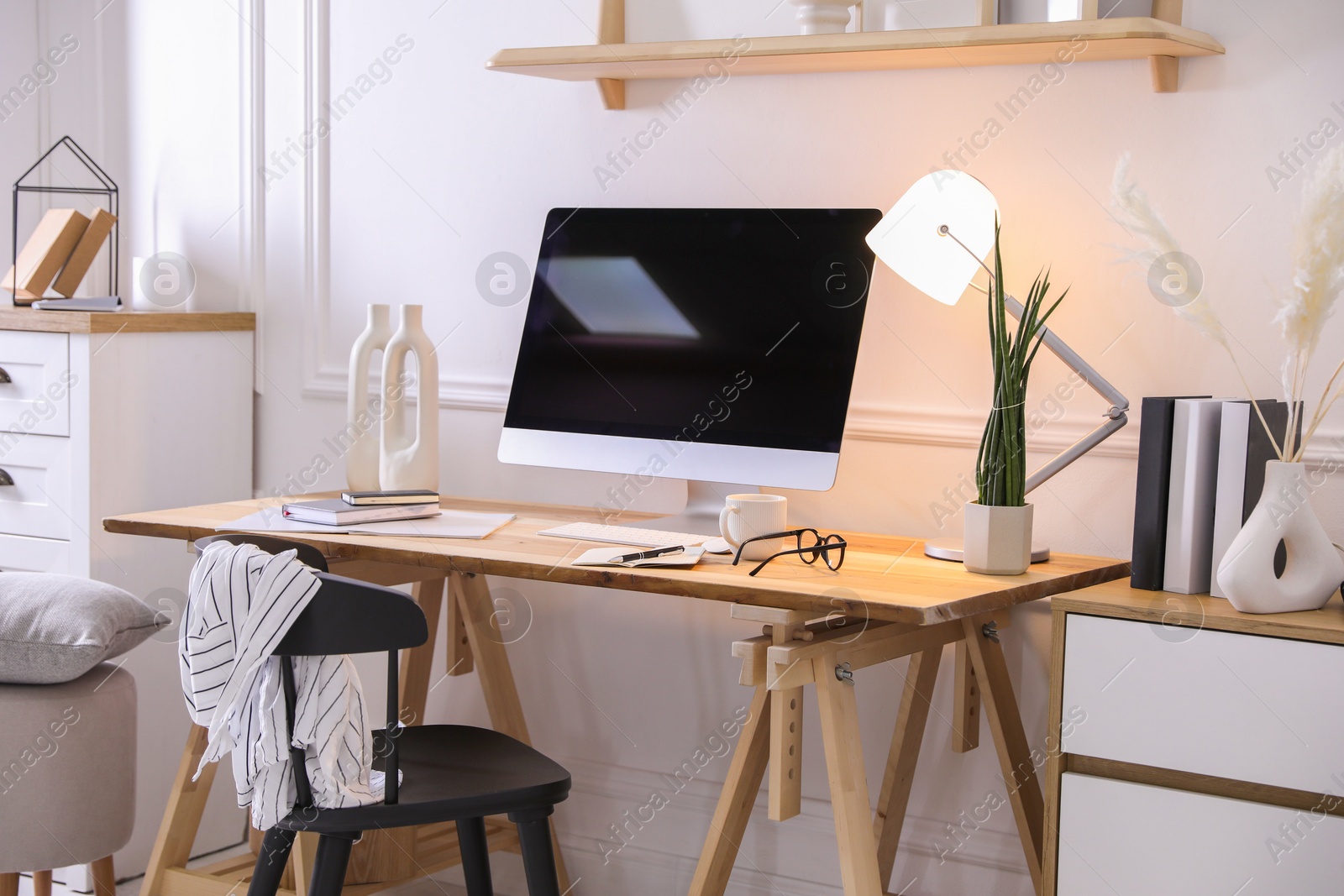 Photo of Comfortable workplace with computer in home office