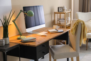 Photo of Comfortable workplace with modern computer in home office