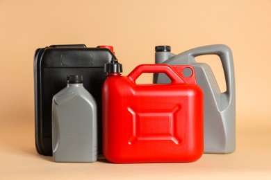 Many different plastic canisters on beige background