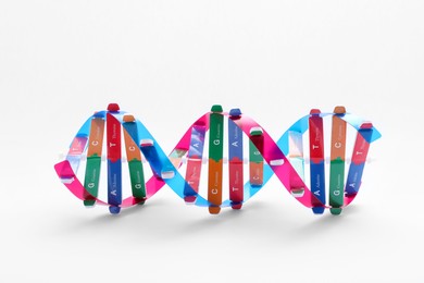 Photo of Colorful DNA structure model on white background