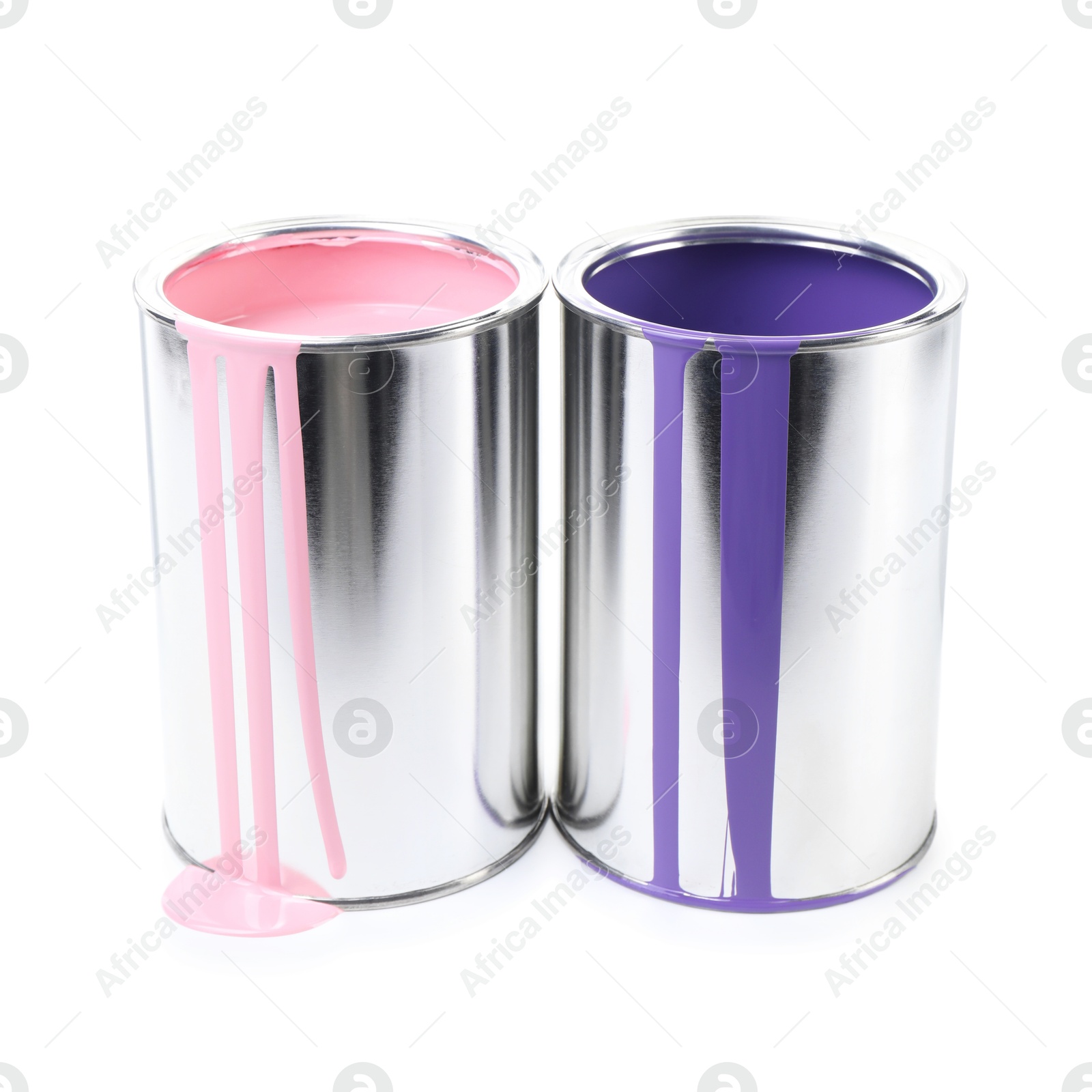 Photo of Cans of pink and violet paints isolated on white