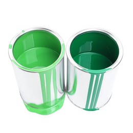 Photo of Cans of green paints isolated on white