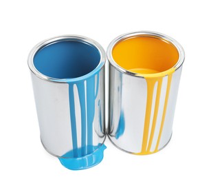 Photo of Cans of light blue and yellow paints isolated on white