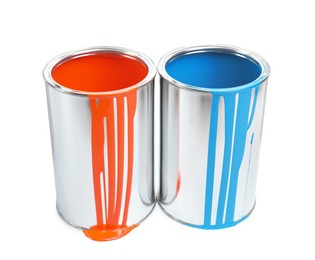 Photo of Cans of light blue and orange paints isolated on white