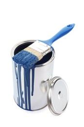 Photo of Can of blue paint and brush isolated on white