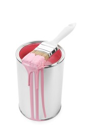 Photo of Can of pink paint and brush isolated on white