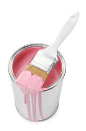 Photo of Can of pink paint and brush isolated on white