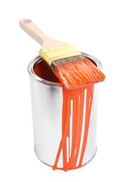 Photo of Can of orange paint and brush isolated on white