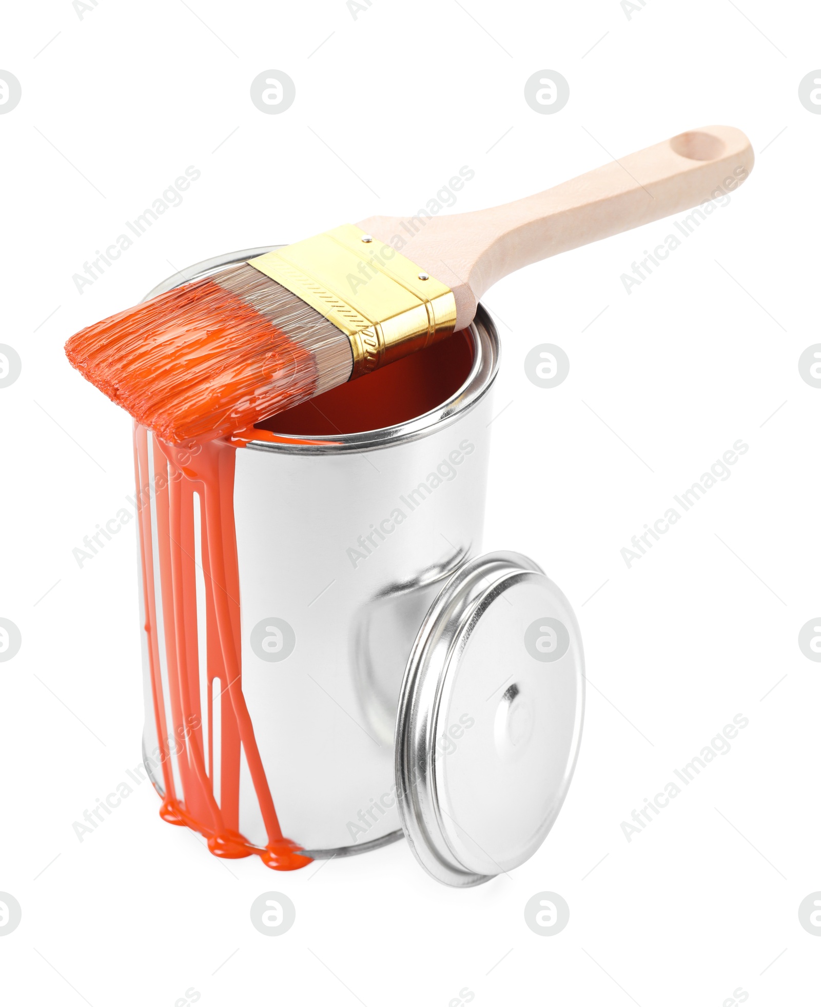 Photo of Can of orange paint and brush isolated on white