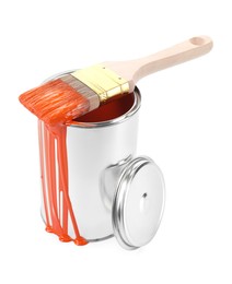 Photo of Can of orange paint and brush isolated on white