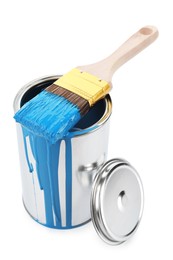 Photo of Can of light blue paint and brush isolated on white