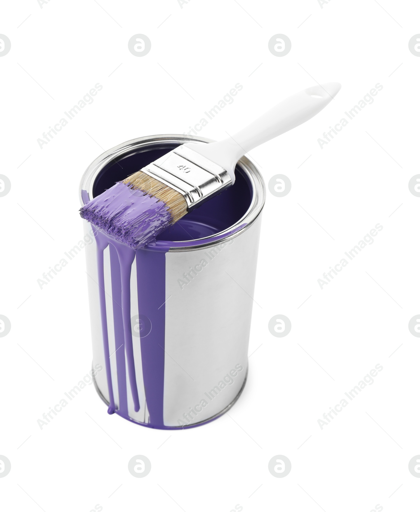 Photo of Can of violet paint and brush isolated on white