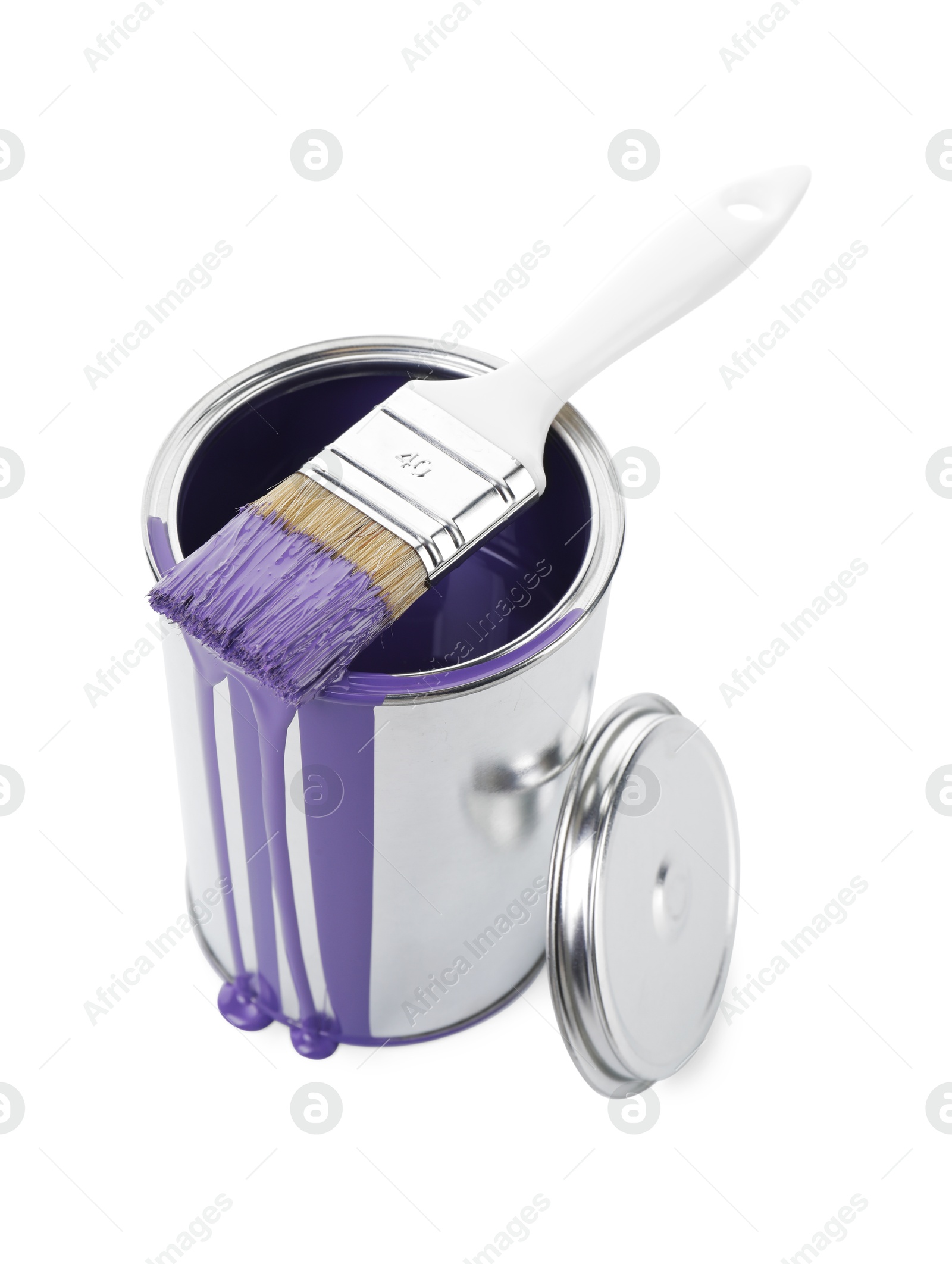 Photo of Can of violet paint and brush isolated on white