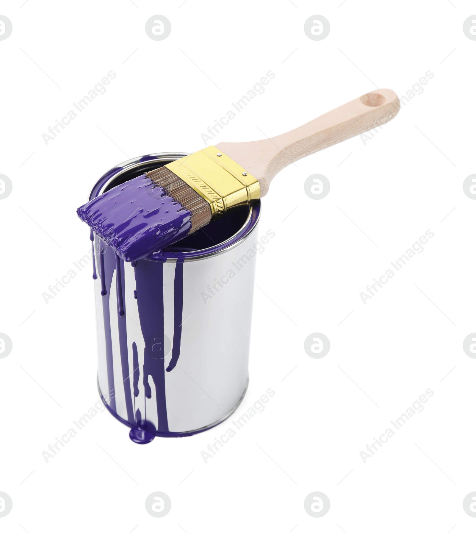 Photo of Can of violet paint and brush isolated on white