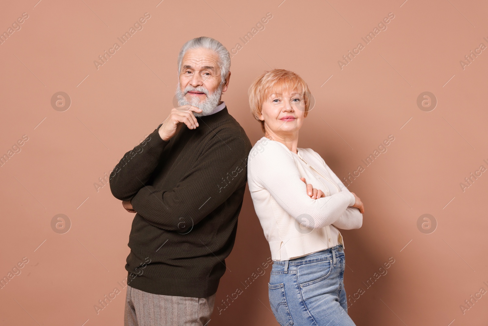 Photo of Portrait of lovely senior couple on beige background