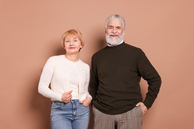 Photo of Portrait of lovely senior couple on beige background