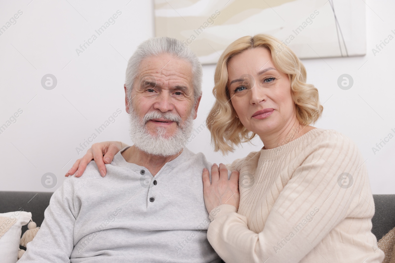 Photo of Senior man and mature woman at home. Happy couple