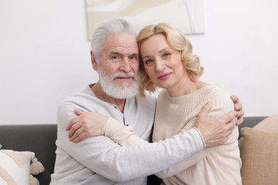 Photo of Senior man and mature woman at home. Happy couple