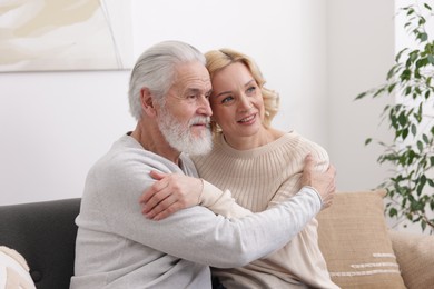 Senior man and mature woman at home. Happy couple