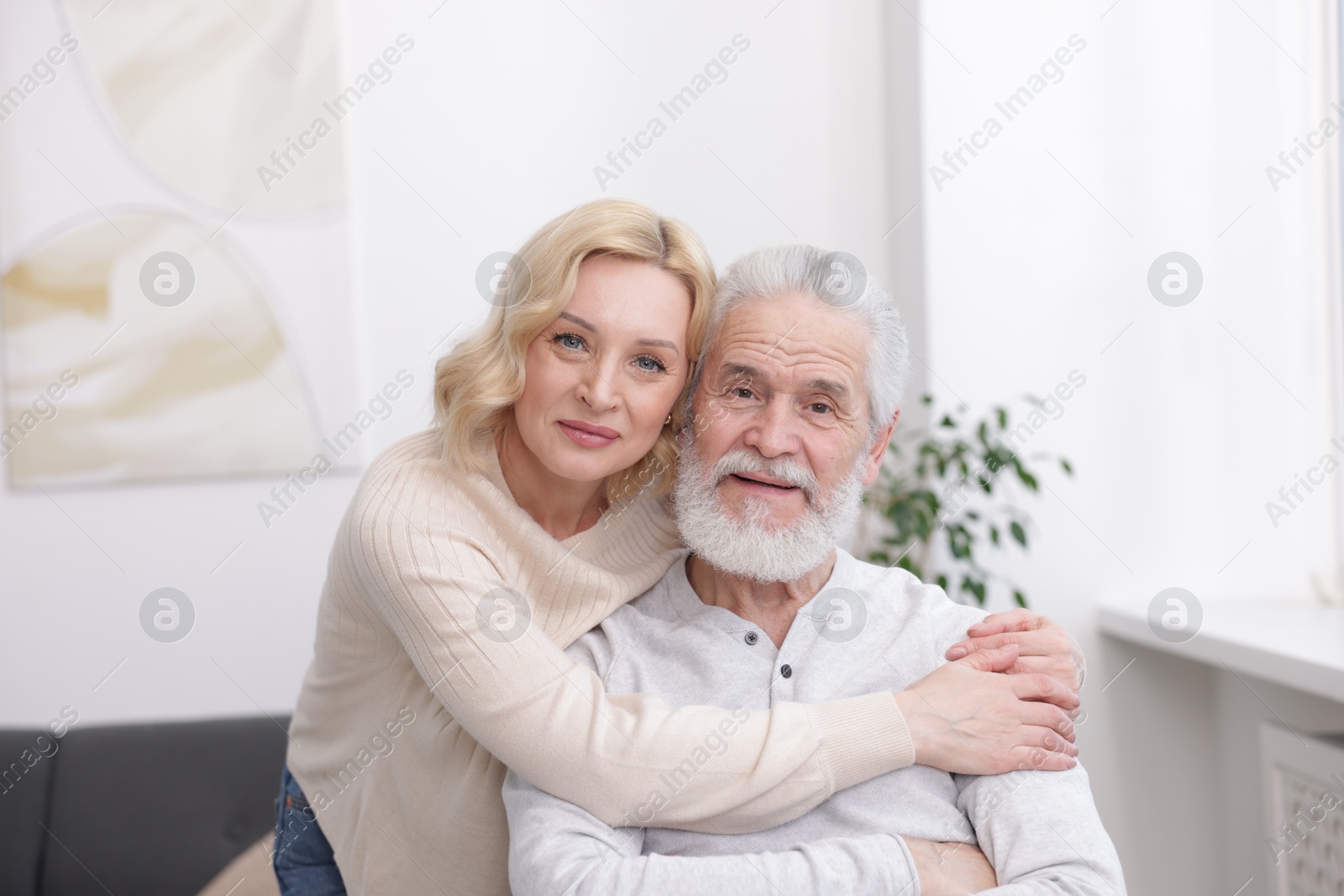 Photo of Senior man and mature woman at home. Happy couple