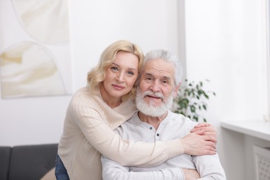 Photo of Senior man and mature woman at home. Happy couple