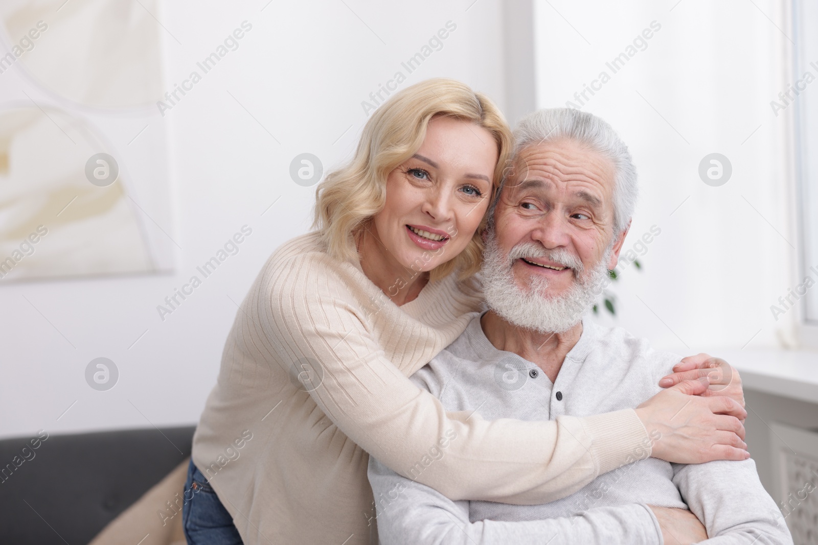 Photo of Senior man and mature woman at home. Happy couple