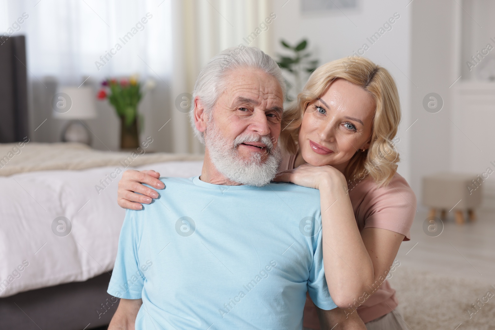 Photo of Senior man and mature woman at home. Happy couple