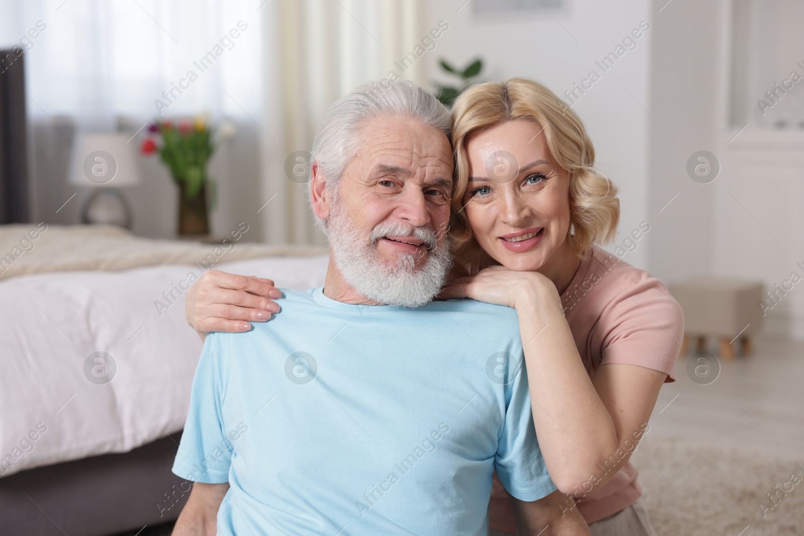 Photo of Senior man and mature woman at home. Happy couple