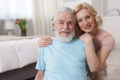 Photo of Senior man and mature woman at home. Happy couple