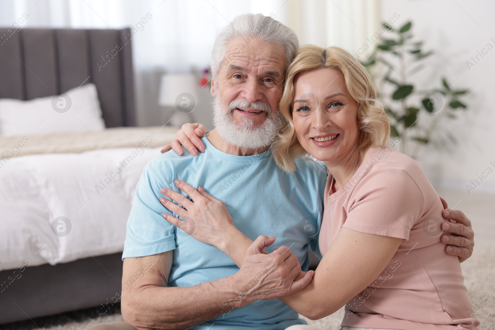 Photo of Senior man and mature woman at home. Happy couple