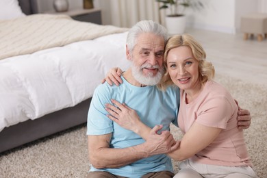 Photo of Senior man and mature woman at home. Happy couple