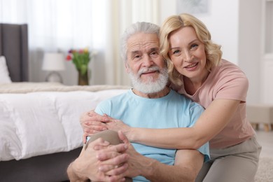 Photo of Senior man and mature woman at home. Happy couple