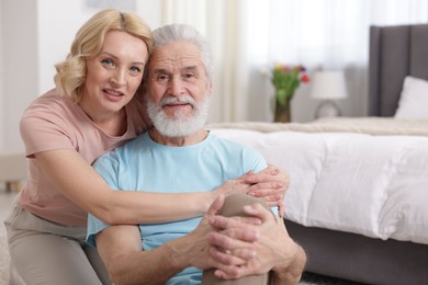 Photo of Senior man and mature woman at home. Happy couple