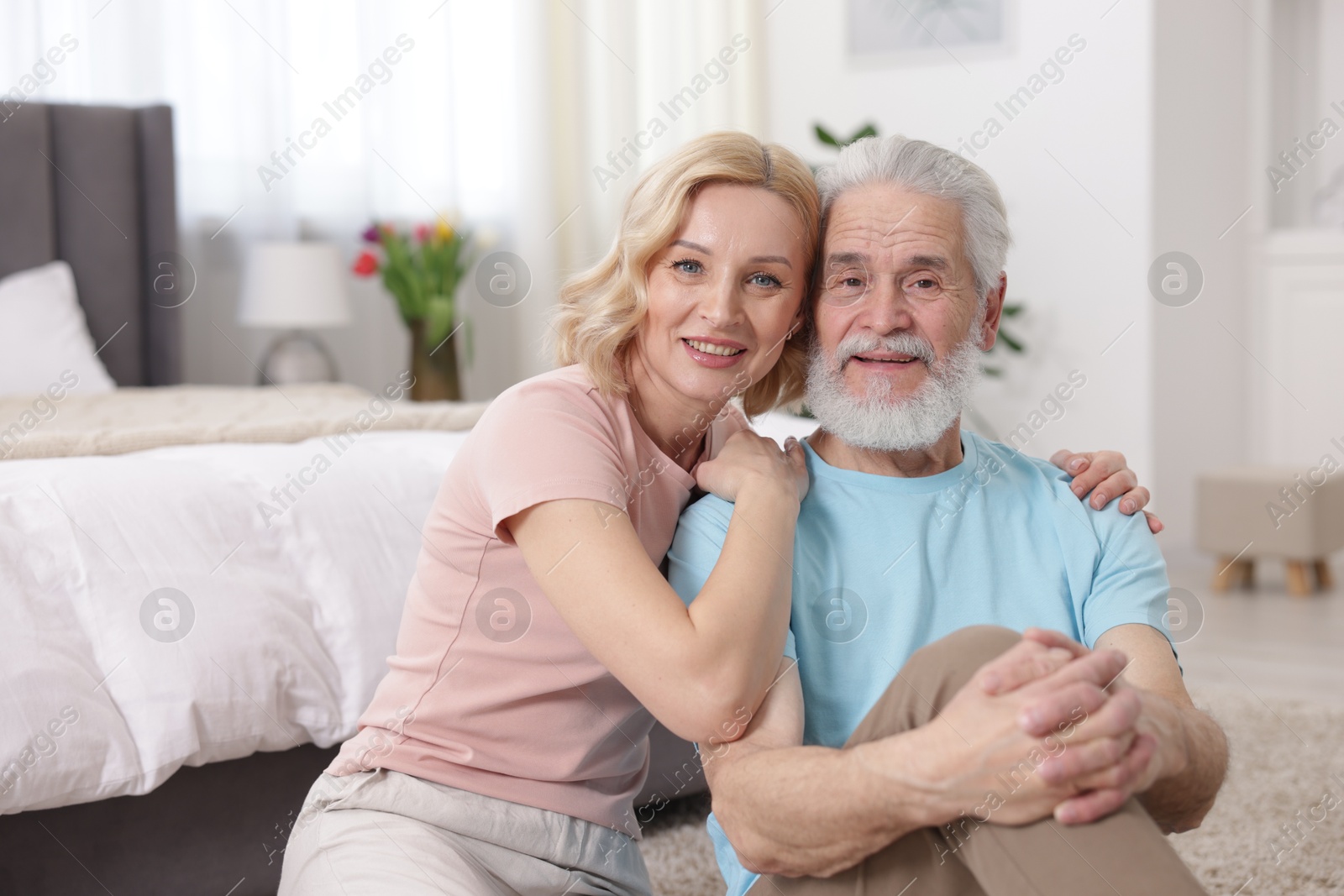 Photo of Senior man and mature woman at home. Happy couple