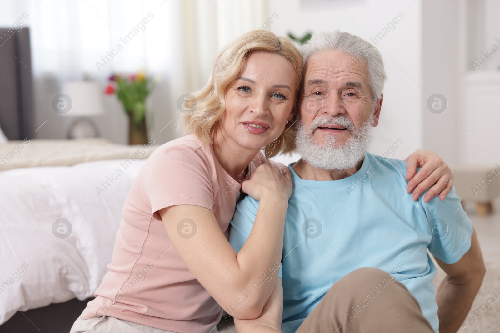 Photo of Senior man and mature woman at home. Happy couple