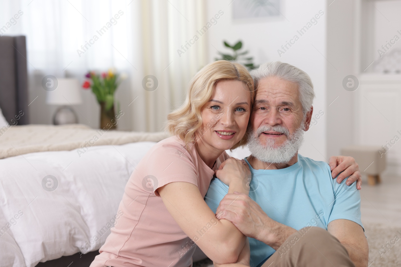 Photo of Senior man and mature woman at home. Happy couple