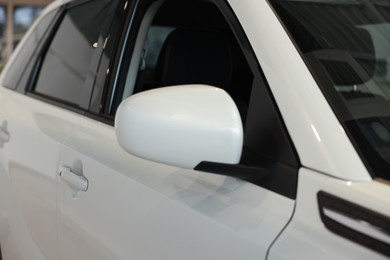 New modern white car in salon, closeup