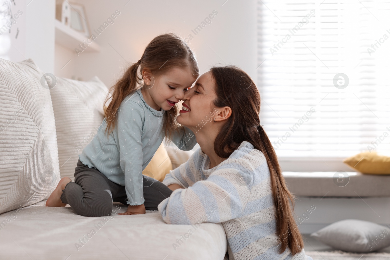 Photo of Happy mother with her cute little daughter at home