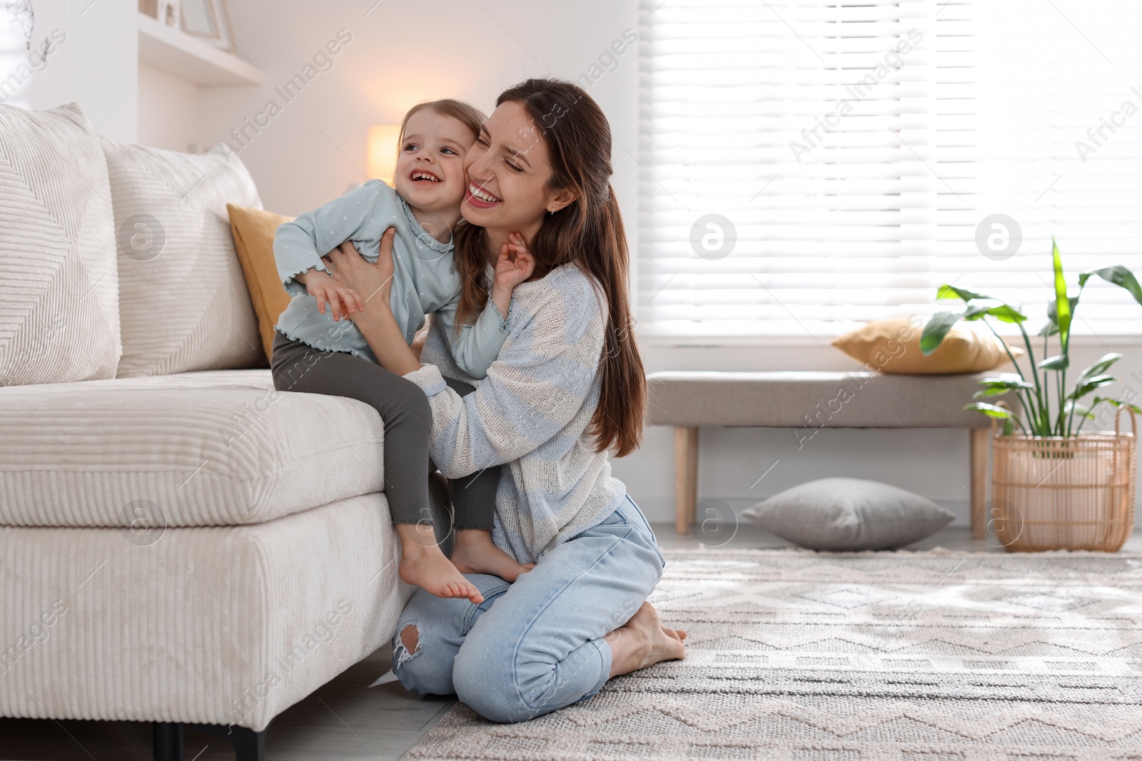 Photo of Happy mother with her cute little daughter at home