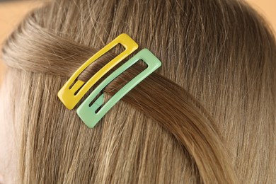 Photo of Woman with beautiful hair clips, closeup view