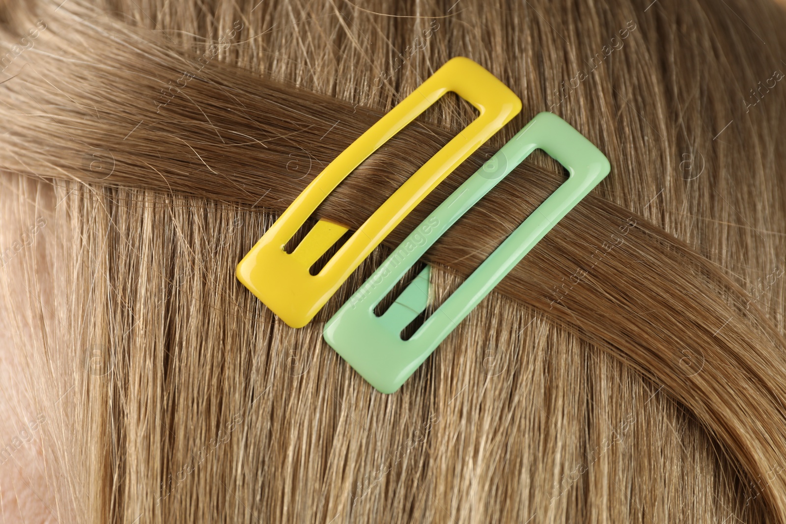 Photo of Woman with beautiful hair clips, closeup view