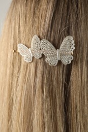 Photo of Woman with beautiful hair clip, closeup view