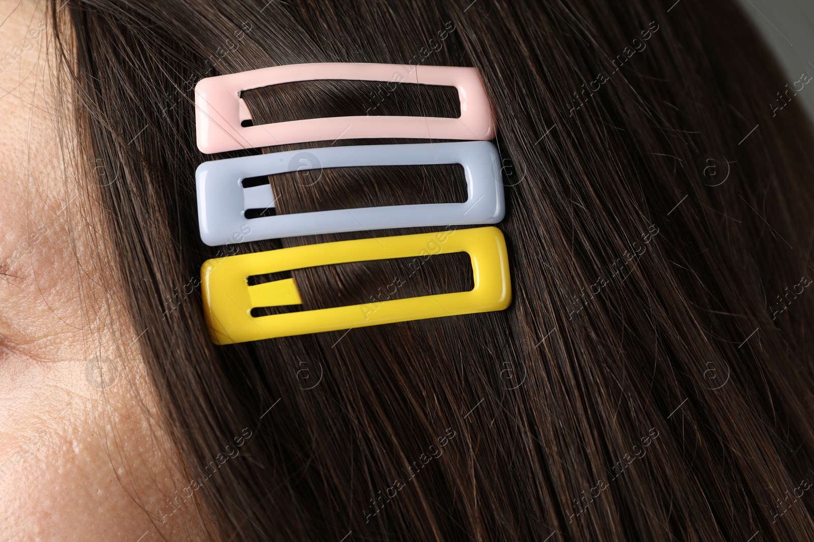 Photo of Woman with beautiful hair clips, closeup view