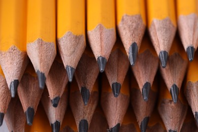 Many graphite pencils as background, closeup view