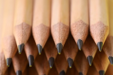 Photo of Many graphite pencils as background, closeup view