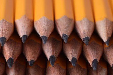 Photo of Many graphite pencils as background, closeup view